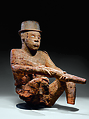 Seated Male Figure with Rifle and Bowler Hat, Wood, Mbembe peoples
